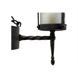 Wrought metal ceiling light, four branch with strapwork lanterns (D55cm); together with a pair of matching wall sconces (H32cm)