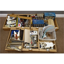  Quantity of clock makers tools and equipment part started brass skeleton clock project, various stains, wire wool, wire brushes, hammers, hand drill, various screws, springs, metal testing stand, etc... in six boxes  