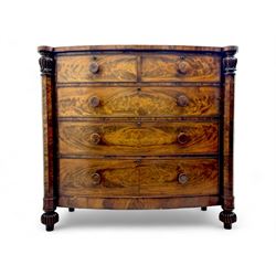 Early Victorian mahogany bow front chest, two short over three long graduating cockbeaded drawers, flanked by faceted columns with carved acanthus leaf capitals, standing on turned bun supports with fluted detailing