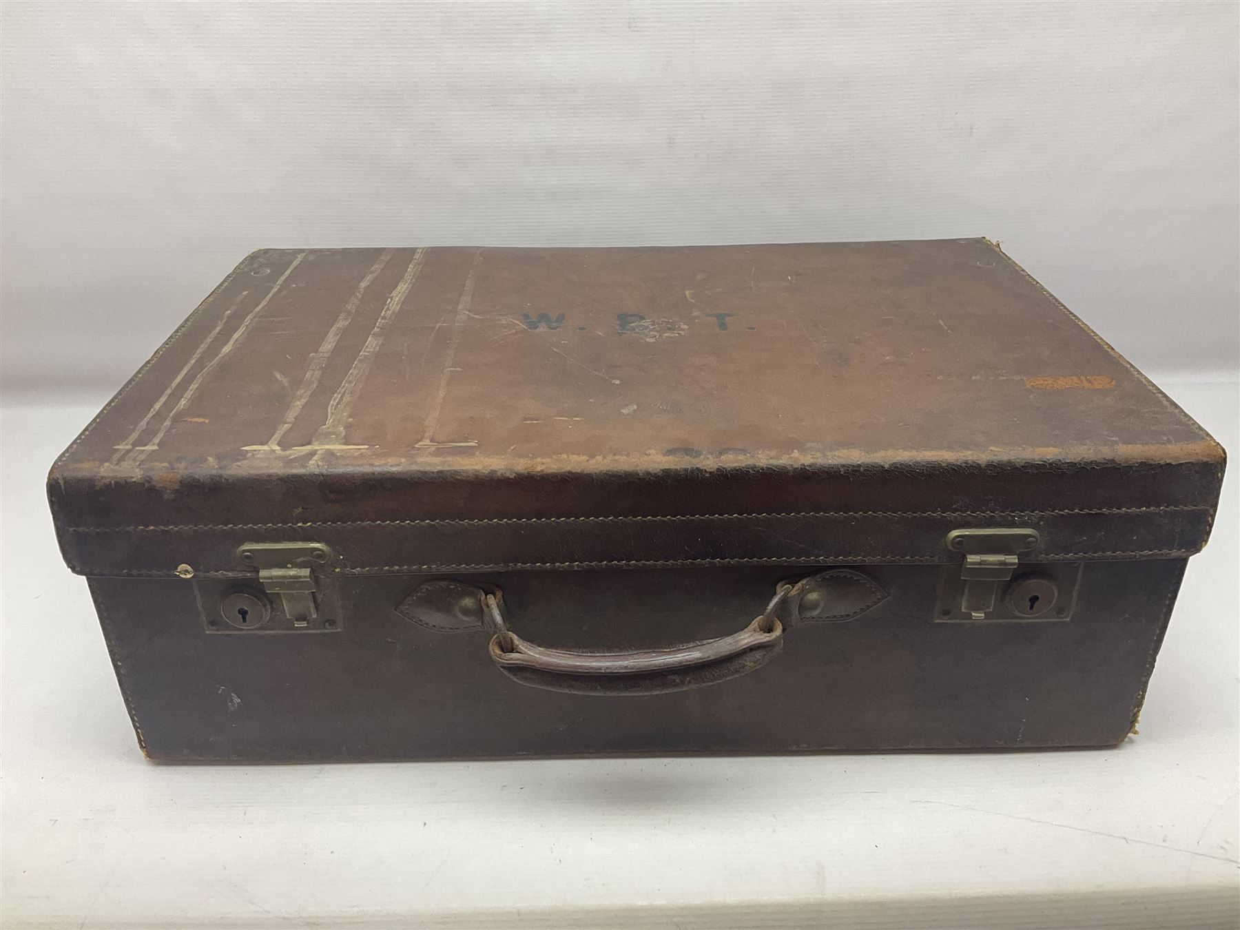 Early 20th century leather bound travelling case, with initials to cover, with fitted interior containing five silver topped glass jars, each engraved with initials, hallmarked The Alexander Clark Manufacturing Co, London 1910 & 1911, case W61cm