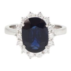 18ct white gold oval cut sapphire and round brilliant cut diamond cluster ring, hallmarked...