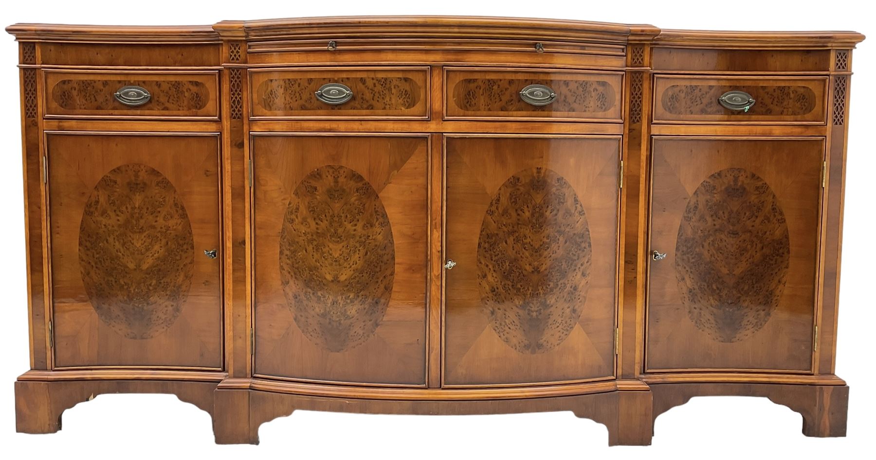 Wade - Georgian design yew wood bow-fronted sideboard, projecting moulded top over four cockbeaded frieze drawers, the central two with pull-out slides, four cupboards below with figured veneers, raised on bracket feet