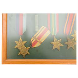 World War II medal group, comprising 1939-45 Star, Pacific Star, Burma Star, Italy Star, 
Atlantic Star, 1939-45 War medal and General Service medal, in glazed frame 