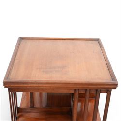 Edwardian mahogany revolving bookcase, square form with moulded top, two tiers with vertical moulded slats, on brass and ceramic castors 