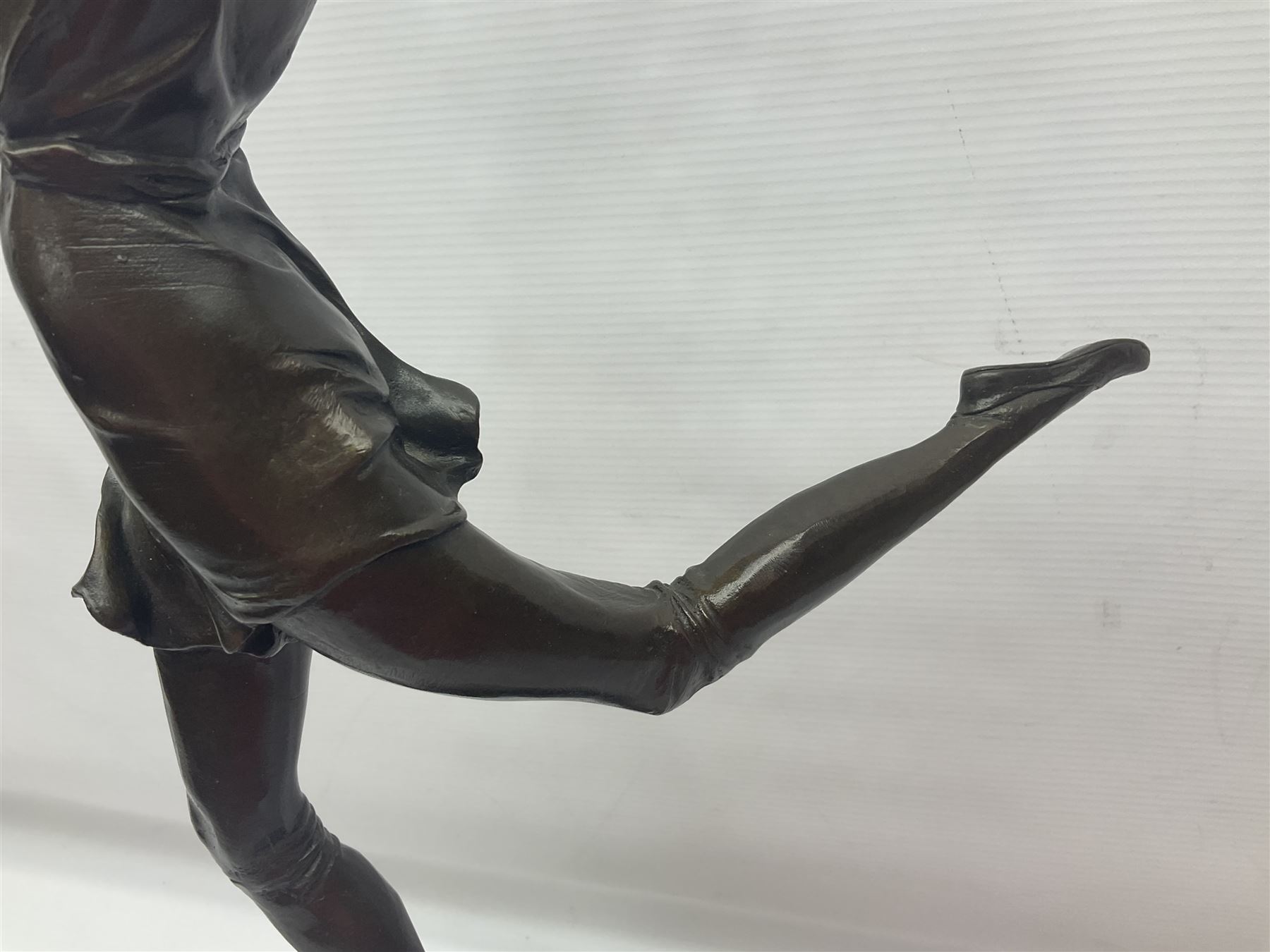 Art Deco style bronze, after Bruno Zach, modelled as a dancer with her arms raised, on a veined marble tapering base signed B. Zach and with foundry seal, H65cm