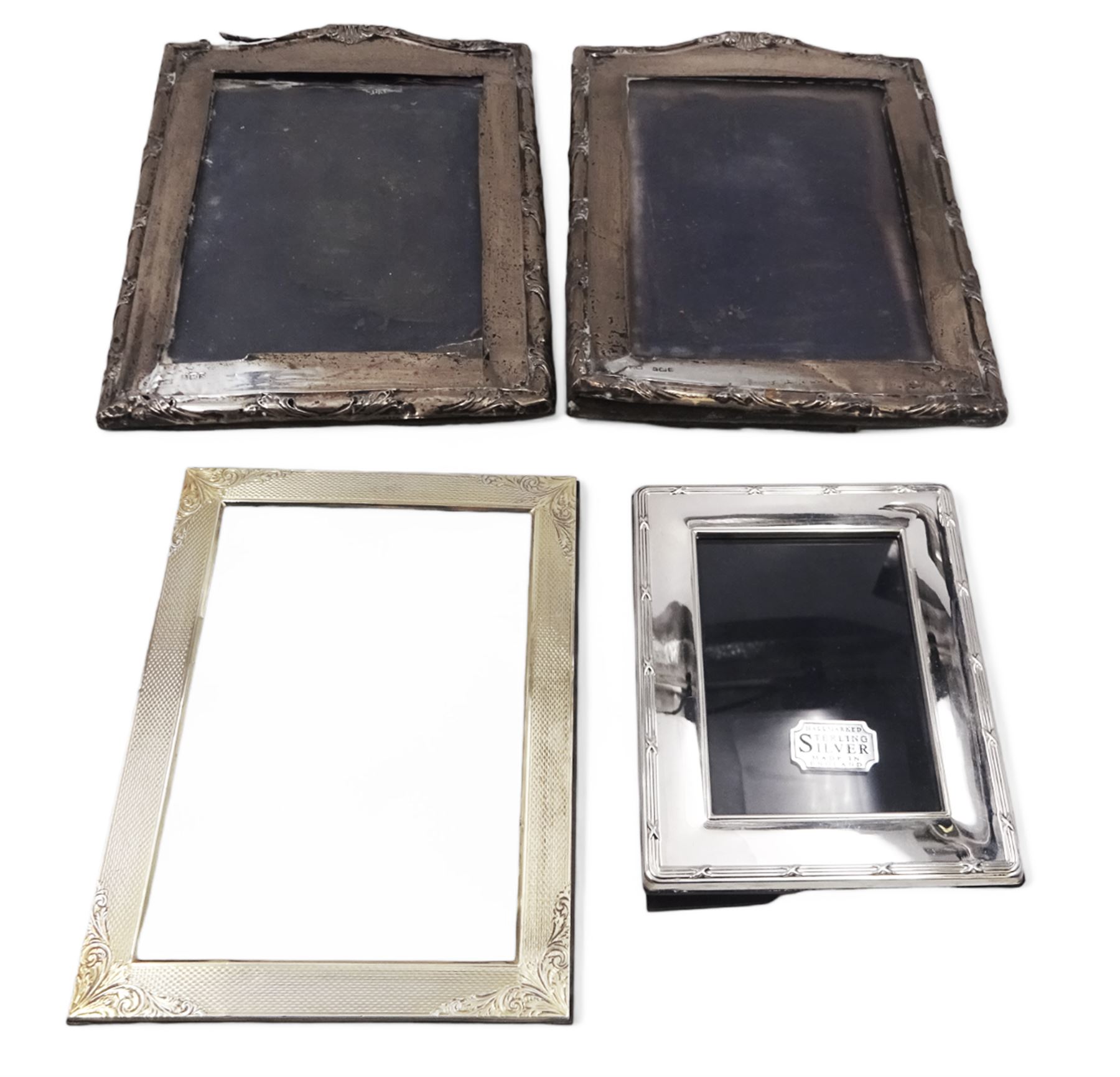 Four silver mounted photograph frames, comprising pair of early 20th century examples, and two smaller modern examples, all hallmarked, tallest H19cm