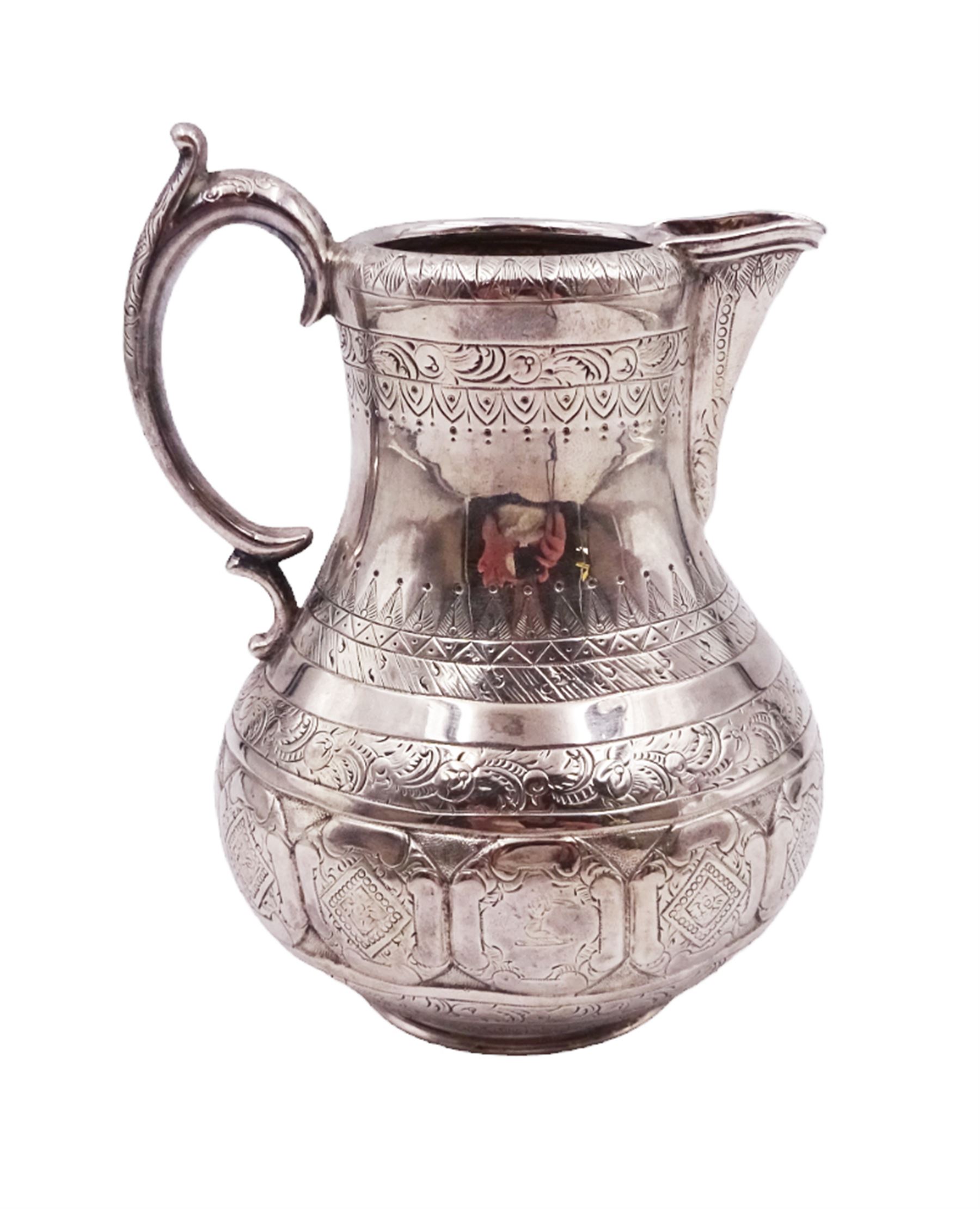 Arts and Crafts silver jug, of bellied form with C handle, the body engraved with a band of floral panels, with engraved scrolling and foliate decoration throughout, hallmarked hallmarked Samuel Smily, Goldsmiths Alliance, London 1873, H13cm