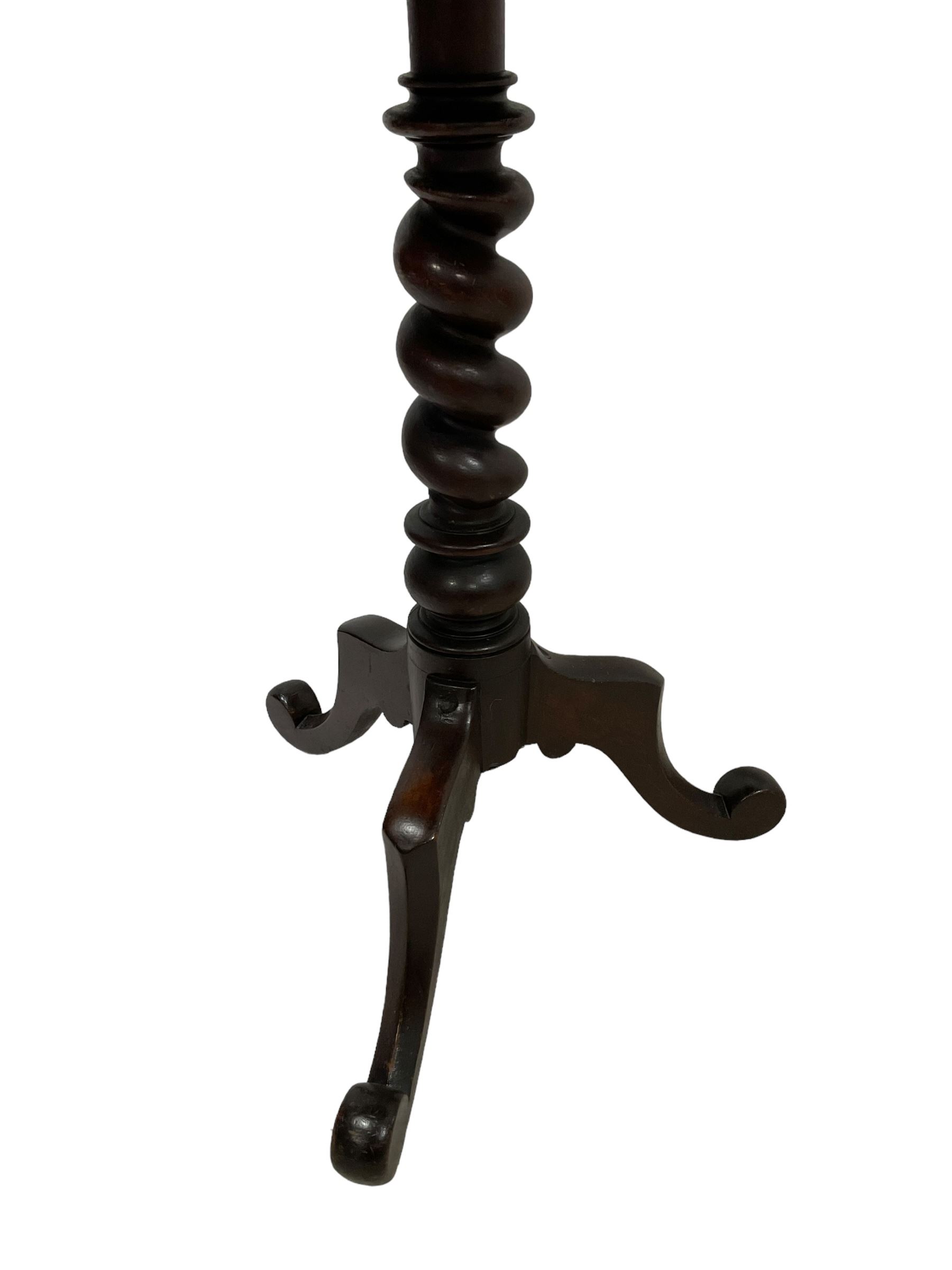 Victorian mahogany tripod table, dished circular top on spiral turned column, three splayed supports with scrolled terminals 