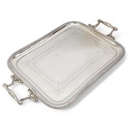 Walker & Hall two handled tea tray, 51cm over handles, two silver plated four division toast racks, and a silver fronted easel photograph frame, Birmingham 1907, H20cm