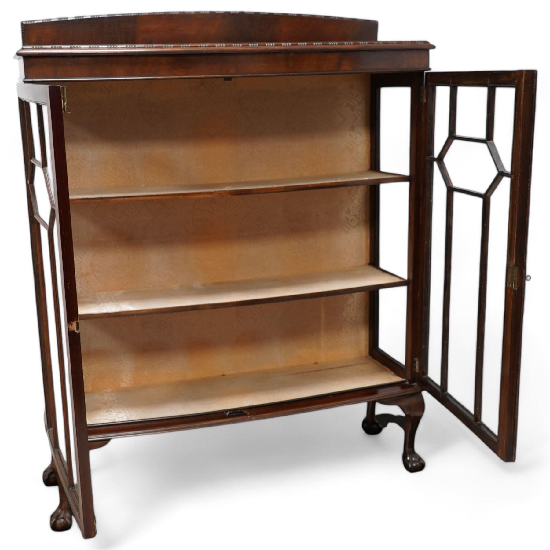 Early 20th century mahogany bow-front display cabinet, fitted with two astragal glazed doors enclosing two shelves, on cabriole supports with ball and claw feet