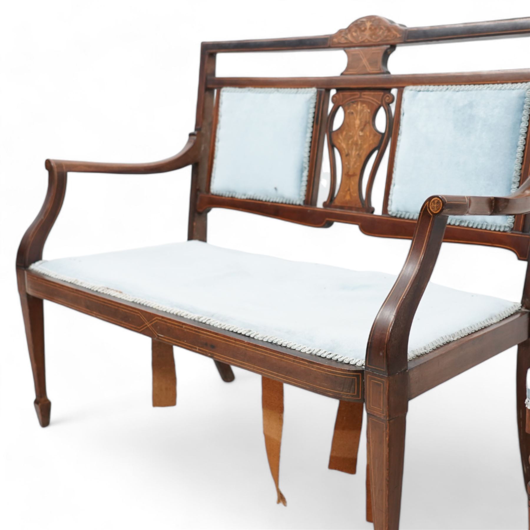 Edwardian inlaid mahogany and rosewood salon suite - two-seat sofa (W112cm, H90cm, D60cm); set of four side chairs (W44cm, H90cm); inlaid with scrolling foliate motifs, upholstered in light blue fabric, on turned supports inlaid with boxwood stringing