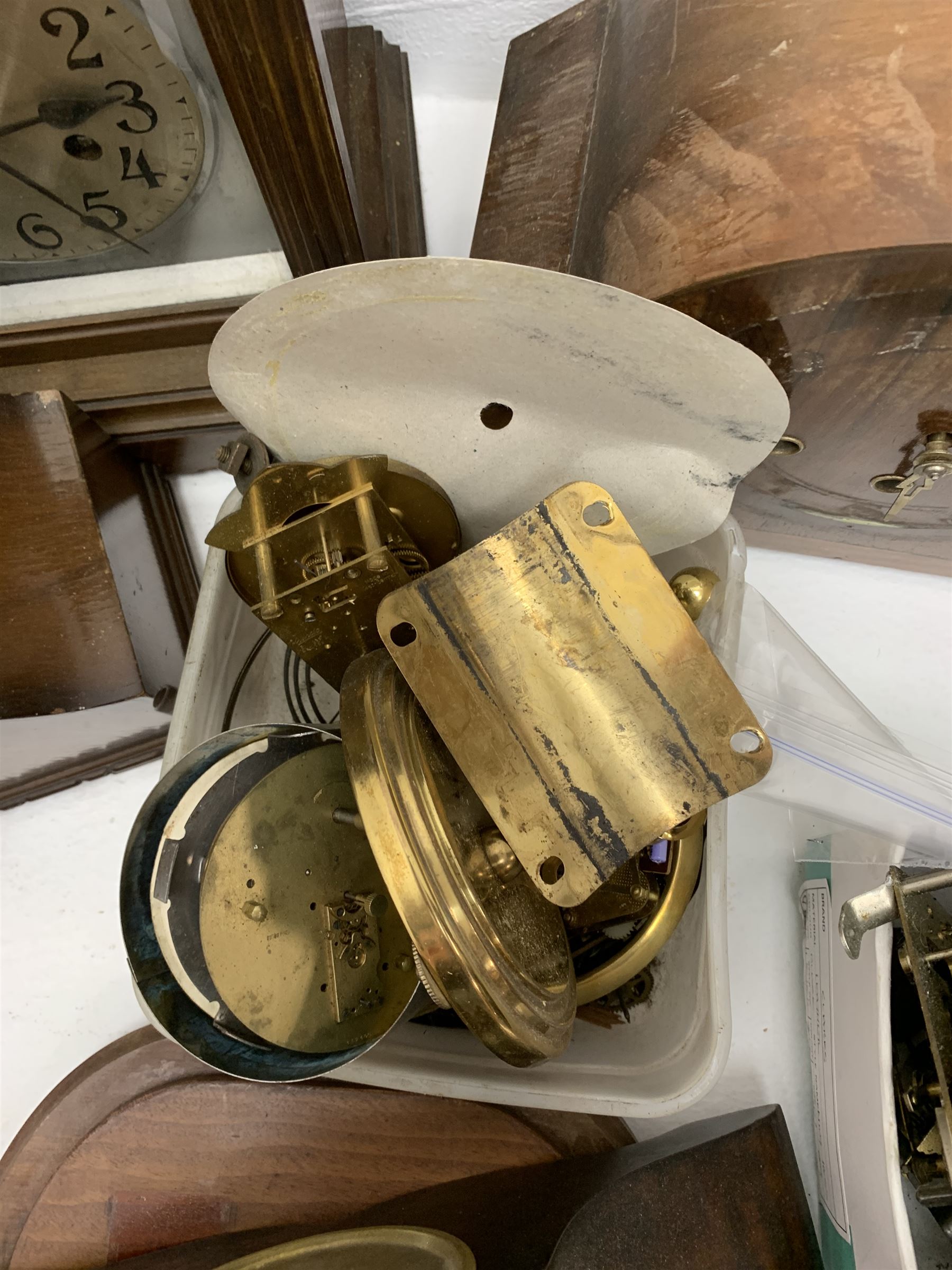 Collection of clock and watch parts - various cases some with movement, ebonised and marble plinths, various clock movements, clock dials, bezels, watches and watch parts etc... in two boxes