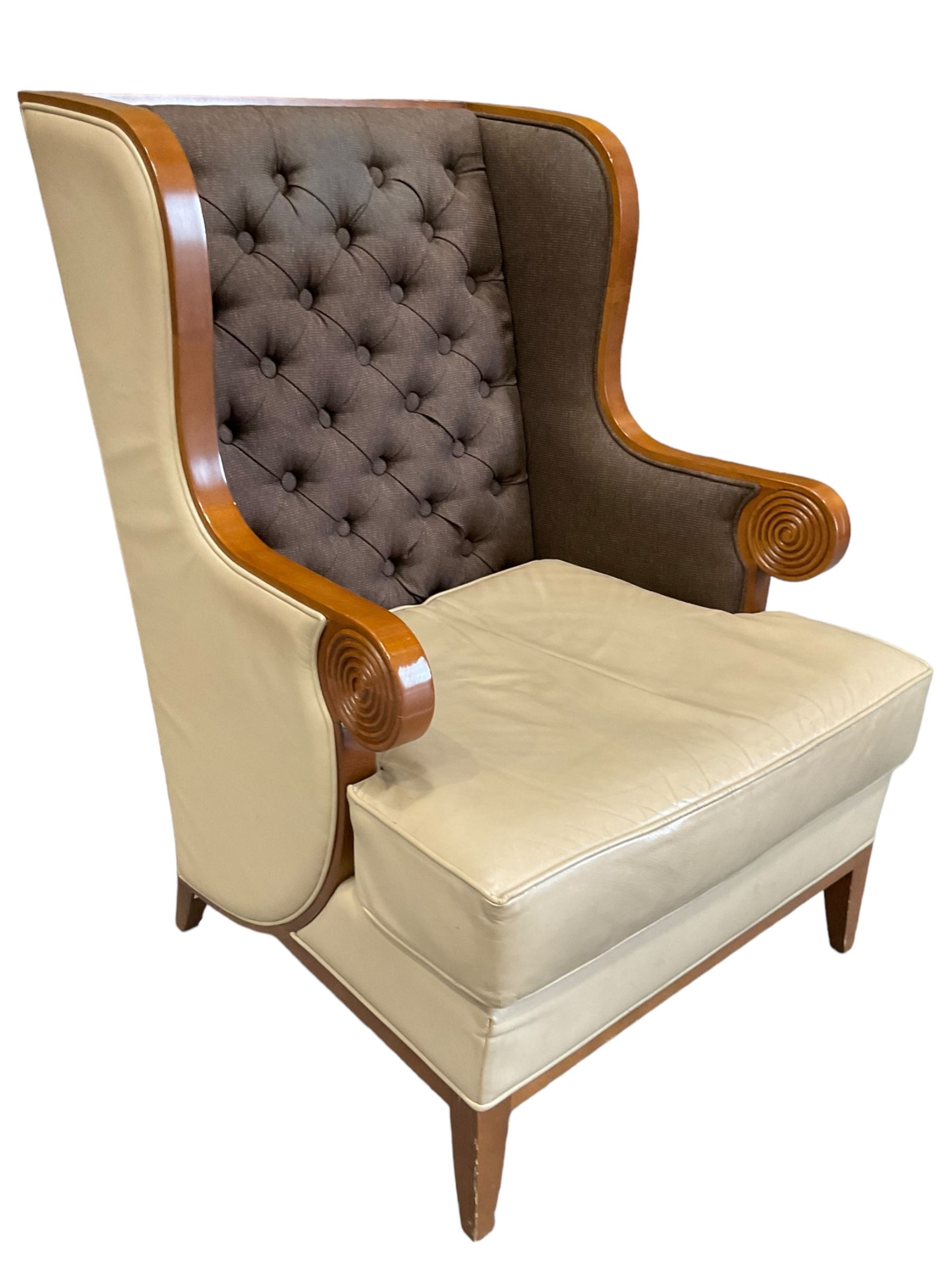 Walnut finish framed wing back armchair upholstered leather and buttoned fabric