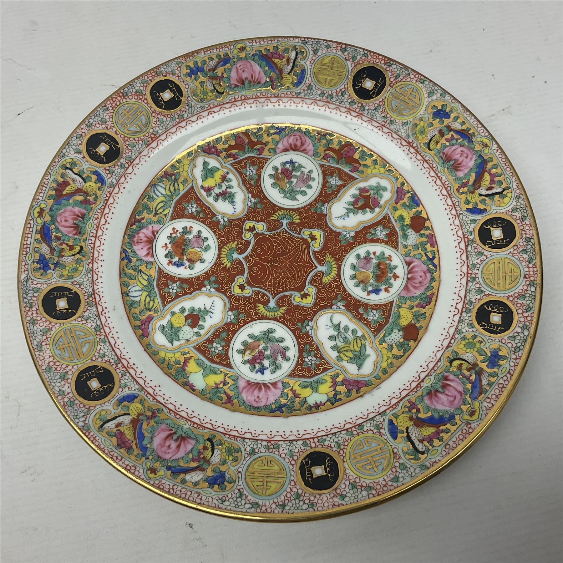 Canton plate and a ginger jar decorated with figures in a garden 