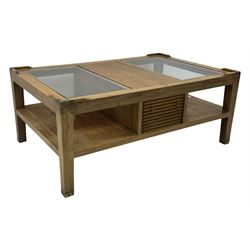 Starbay Tobago cherry wood coffee table, rectangular top with two inset glass panels, central drawer with louvred front and brass handles, flanked by open shelving, raised on square supports with metal corner brackets