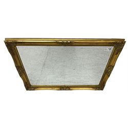 Swept gilt framed wall mirror with rectangular bevelled plate