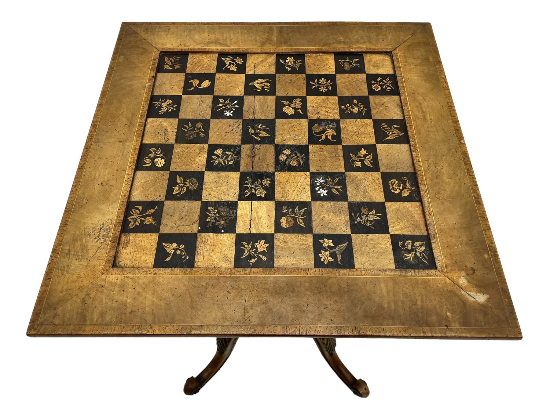 Late 19th century walnut games table, the square top with sunken inlaid chessboard decorated with inlaid floral bouquets, shaped and pierced frieze rails, on quadruple spiral turned pillars, concaved square platform inlaid with flowers, on acanthus leaf carved splayed supports with scrolled terminals 