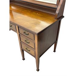 Late 19th century walnut dressing table, wide rectangular bevelled swing mirror in moulded frame, shaped horns carved with scrolls, moulded rectangular top over seven drawers, on square tapering supports with spade feet 