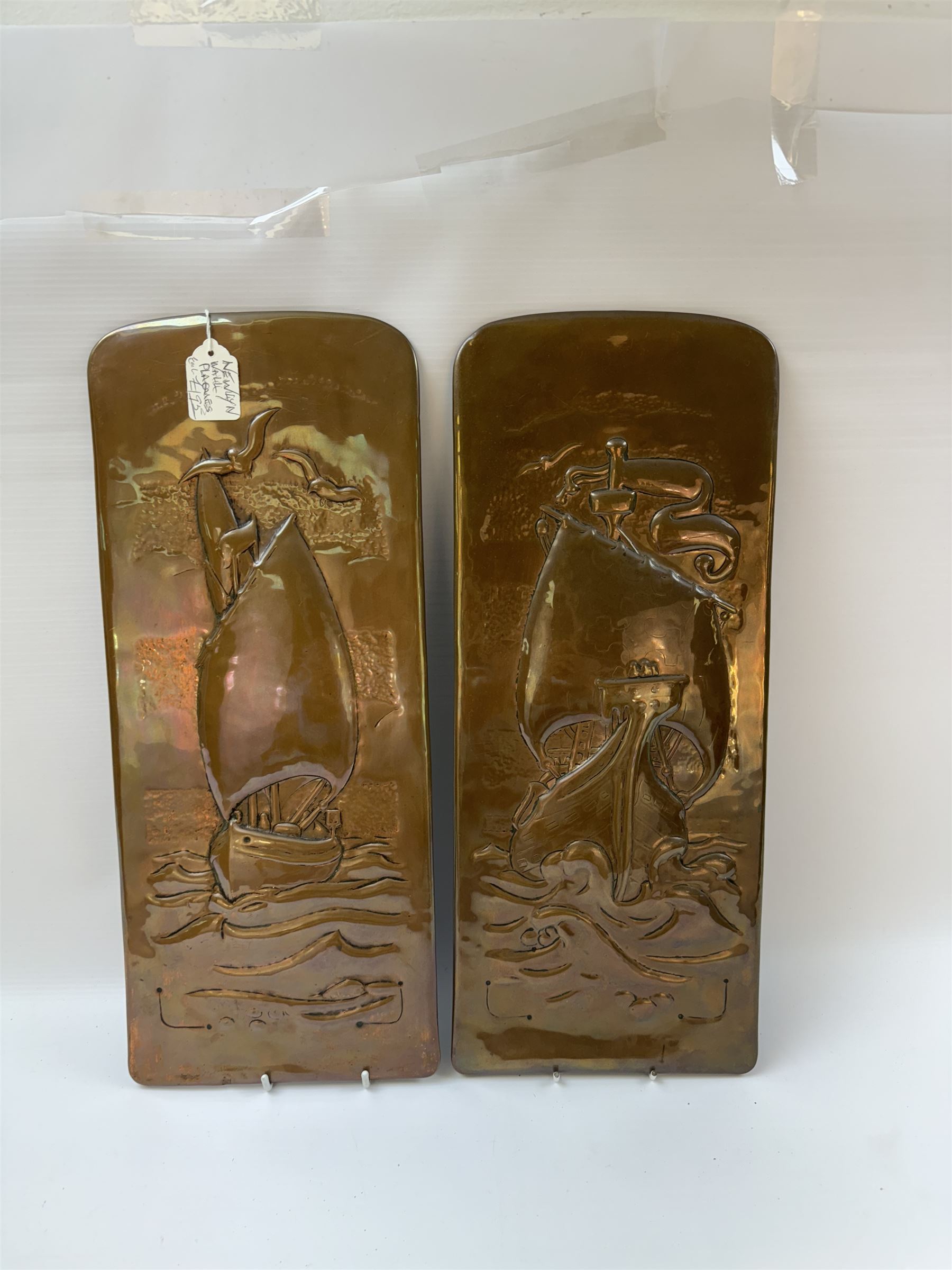 Two Newlyn Arts and Crafts copper wall plaques, each embossed with a ship, H43cm