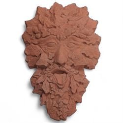 Terracotta red cast stone Greenman wall mask (37cm x 24cm); together with a lion wall mask (35cm x 26cm)