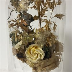 Victorian dome on ebonised wooden base, containing parian vase of silk and dried flowers, H47cm