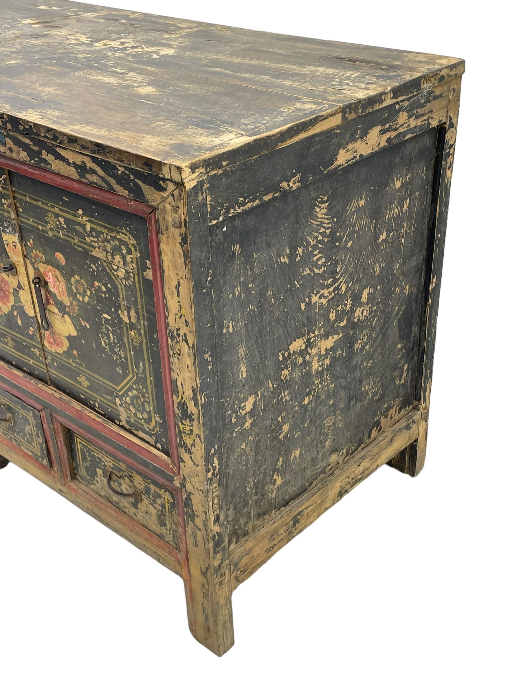 19th century Chinese Qing dynasty painted elm cupboard, Shanxi province, two double cupboards enclosed by doors painted with figure and flower heads, fitted with four small drawer, on stile supports 