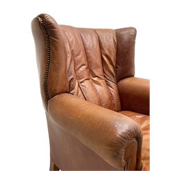 Tetrad - 'Blake' club armchair, fanned wingback and rolled arms upholstered in tan brown leather, on ball and claw carved cabriole feet 