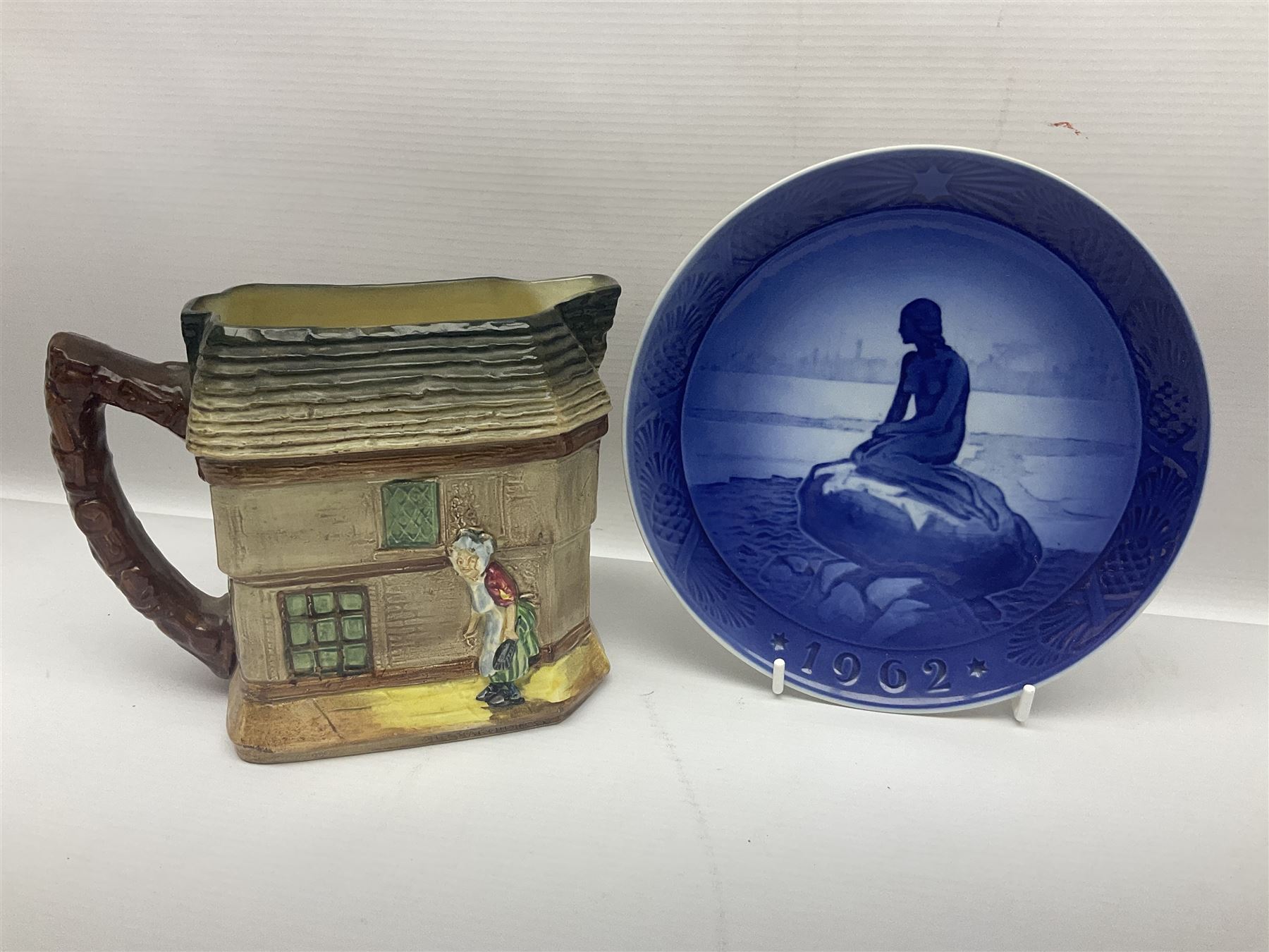 Royal Doulton Old Curiosity Shop jug, toby jug, novelty cup and saucer and Royal Copenhagen 1962 Christmas plate