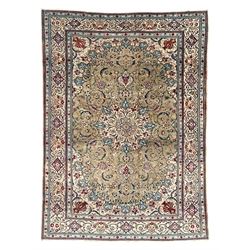 Persian Kashan olive ground carpet, central rosette medallion surrounded by swirling leafy...