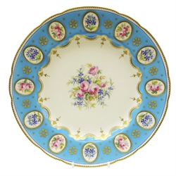  Early 20th century Minton shaped cabinet plate the reserve painted with floral sprays within a turquoise and raised gilt border having twelve oval panels hand painted with roses and other flowers c1900, pattern no. 5507, D24cm. Provenance Property of Bob Heath, Brandesburton Formerly of Ravenfield Hall Farm near Rotherham  