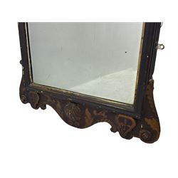 18th century black lacquered and gilt wall mirror, broken arch pediment with central cartouche decorated with curled leaves and foliate motifs, scrolled acanthus leaf eared brackets, bevelled mirror plate within gilt slip and moulded outer frame, lower shell motif surrounded by curled acanthus leaves and shield motifs 