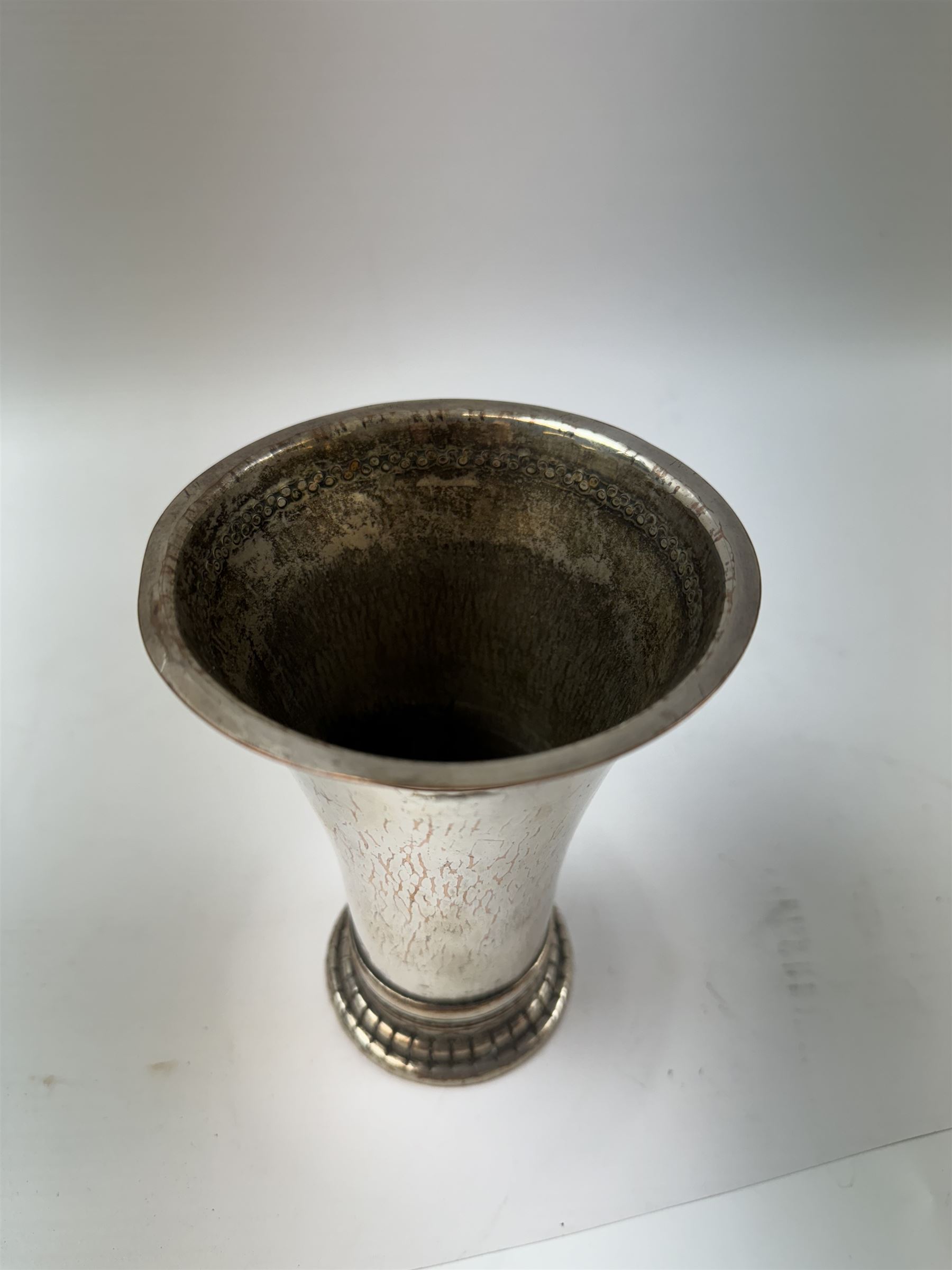 Keswick School of Industrial Arts, an Arts and Crafts plated copper vase, flared cylindrical form, stamped KSAI beneath, H14cm