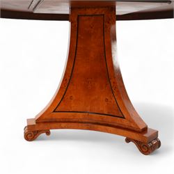 Regency design figured elm centre table, circular top with segmented veneers and ebony band, the frieze decorated with applied twist moulding, on tapered triangular pyramid pedestal, S-scroll carved feet