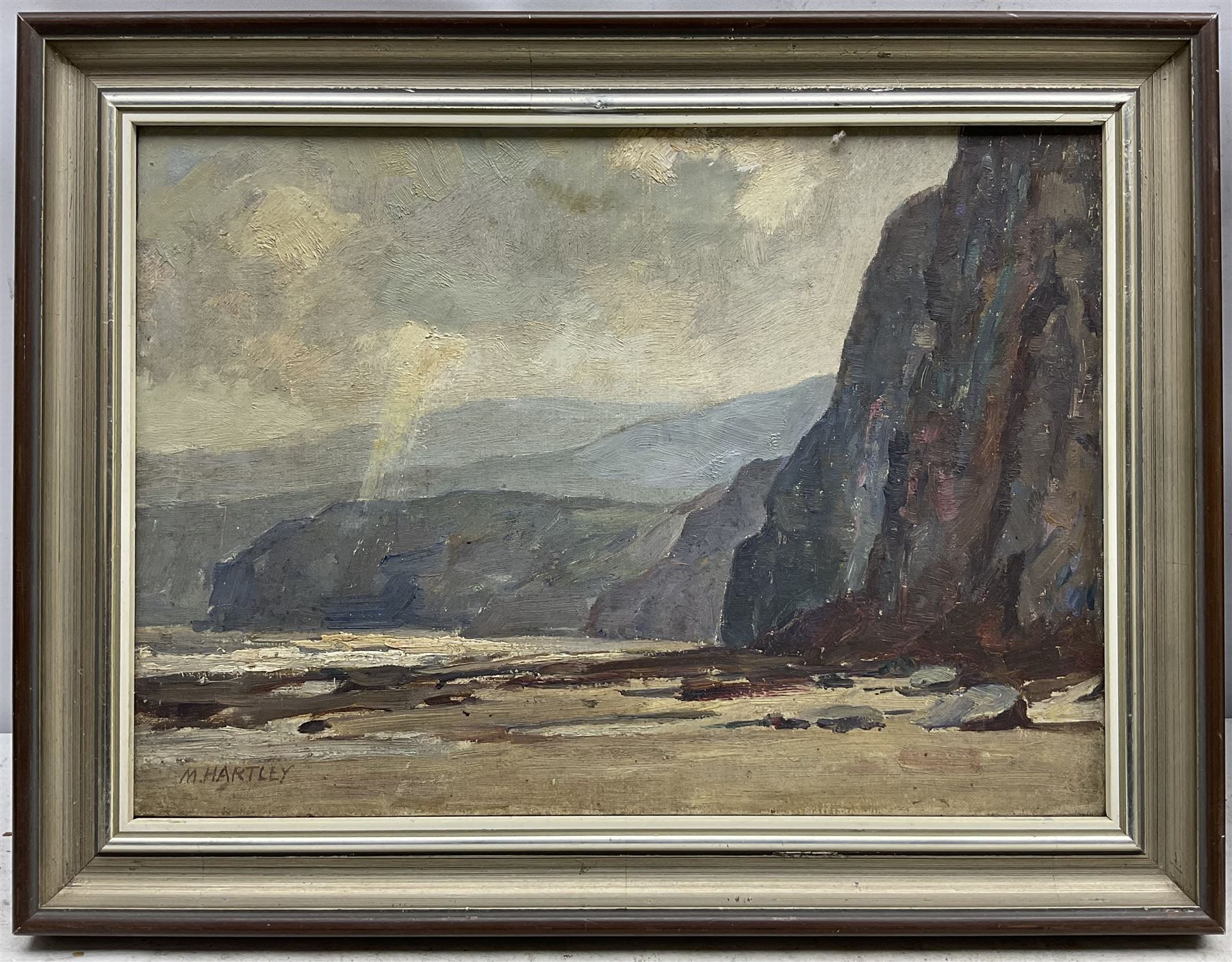 Marie Hartley (Yorkshire 1905-2006): 'Cliffs near Robin Hood's Bay', oil on canvas signed, titled on printed label verso 25cm x 35cm