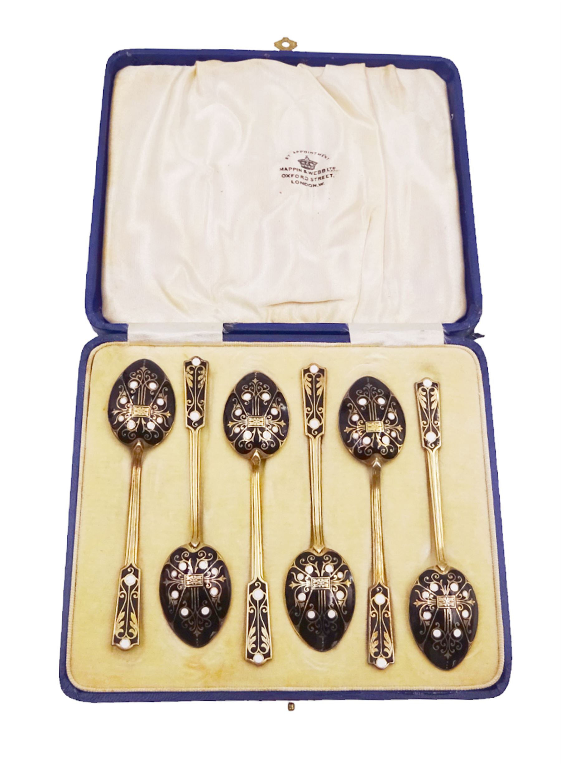 Set of six 1930s silver-gilt and enamel coffee spoons, the bowls and finials decorated verso in black and white enamel, hallmarked Turner & Simpson Ltd, Birmingham 1933, contained within fitted case