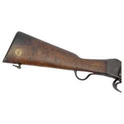 Martini-Henry MKII/2 Carbine, the 52cm round barrel with various inspectors marks,   fitted with ladder sight, with various inspector's marks, the action marked Enfield, the walnut full stock with two steel barrel bands, the butt inset with brass roundel stamped' 12 1893 V 1 GR. A 6', and with Sold Out of Service arrows to the butt, action and barrel, steel cleaning rod beneath, overall 96cm
Sold as an exempt item under Section 58 (2) of the 1968 Firearms Act, to be held as a curiosity or ornament


