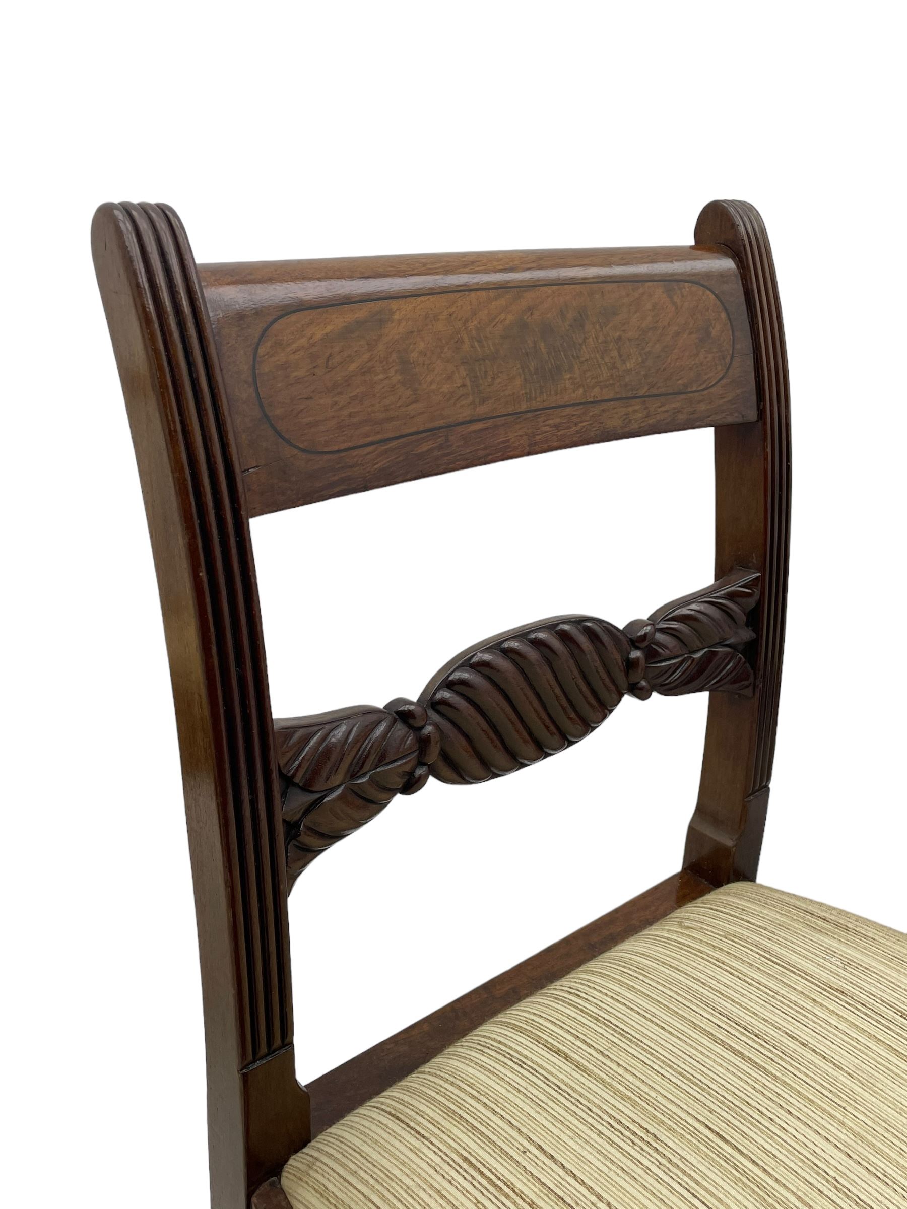 Georgian design set of six (6+2) mahogany dining chairs, the bar cresting rail inlaid with figured mahogany panel, shaped twist lobe carved middle rail with extending stylised leaf decoration, upholstered drop-in seat, on turned front supports 