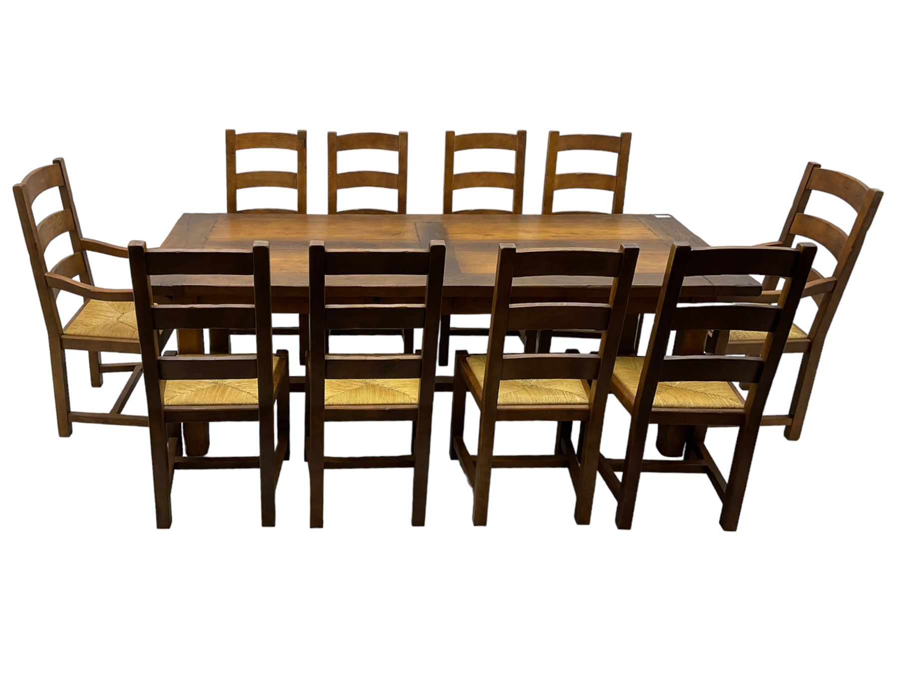 Antix Furniture - oak extending refectory dining table, rectangular plank top with two additional leaves and two drawers to the longer side, on square supports connected by H-stretcher; set of ten (8+2) ladder back dining chairs with rush seats