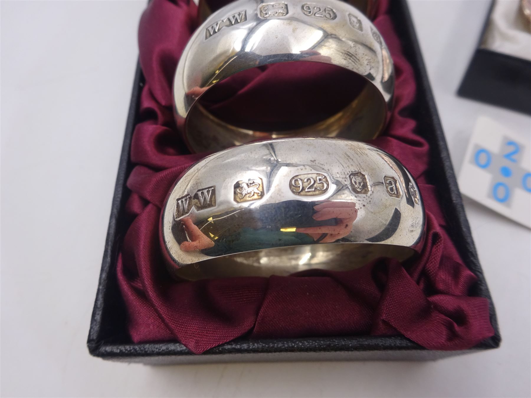 Set of six modern silver napkin rings, hallmarked London 2000, makers mark WW, together with a modern silver pin dish, hallmarked Hugh Crawshaw, Sheffield 2000, both boxed