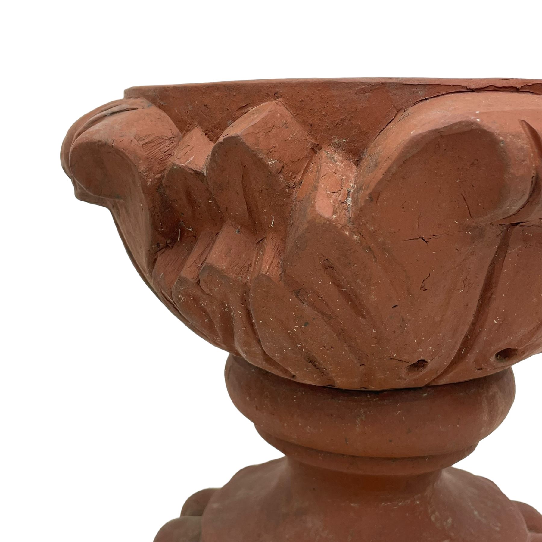 Pair of late 19th to early 20th century red terracotta garden urn planters, the shallow bowls moulded with curled acanthus leaf decoration, on circular foot with globular beaded moulding, octagonal base