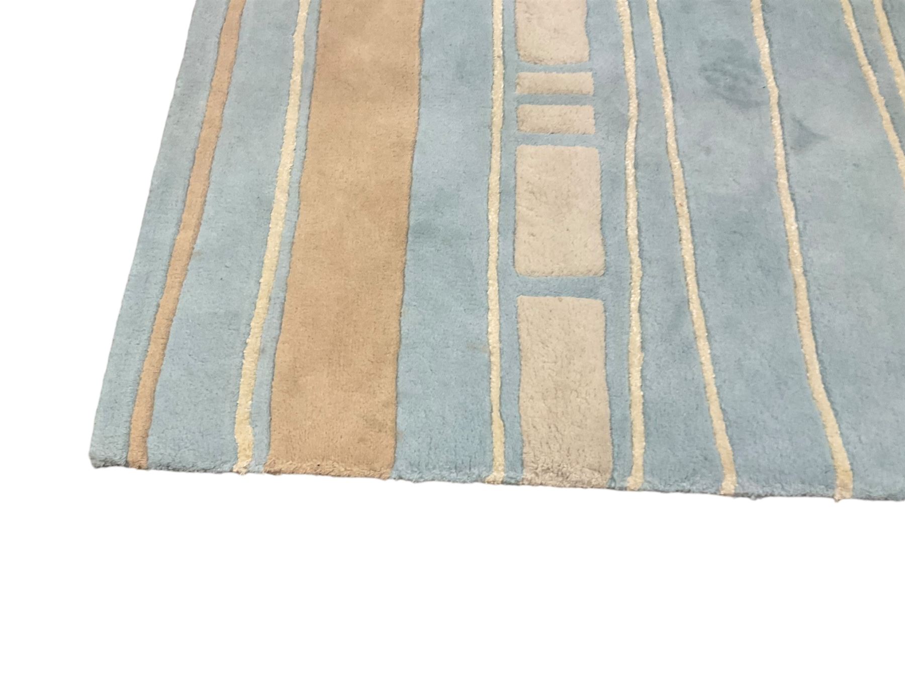 Contemporary pale indigo and beige ground rug, decorated with alternating stripes and geometric shapes