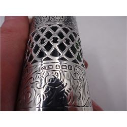 Early 20th century silver mounted green glass scent bottle, the silver body engraved profusely with foliate scrolls, with central pierced latte band revealing the green glass beneath, the hinged lid opening to reveal wooden stopper, hallmarked George Edwin Walton, Birmingham 1912, H7cm