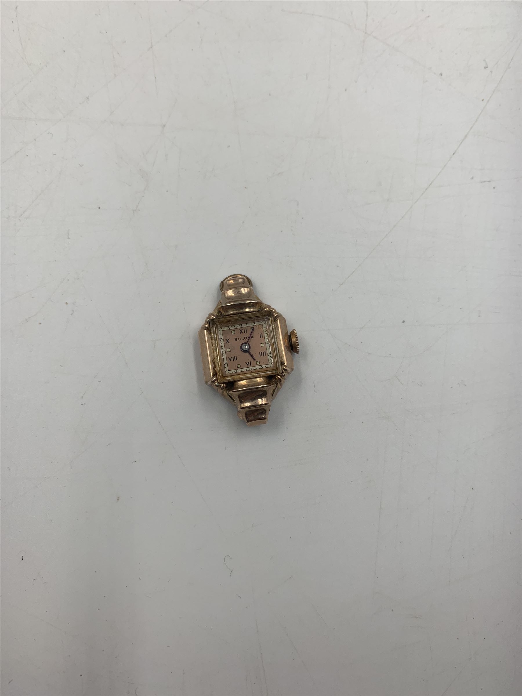 Early 20th century keyless fob watch, white enamelled dial with Roman numerals and subsidiary seconds dial, outer case stamped 14K, 9ct gold cased Rite-Tyme mechanical wristwatch, on a gilt stainless steel bracelet, a ladies 9ct gold cased mechanical movement wristwatch, with blue enameled case, on a rolled gold bracelet strap, ladies 9ct gold mechanical movement wristwatch on an expanding bracelet strap stamped 9ct and another 9ct gold cased mechanical movement wristwatch, together ladies Rotary 9ct gold cased mechanical wristwatch and ladies Bulova rolled gold mechanical wristwatch (lacking straps)