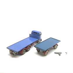 Shackleton Models - unboxed and playworn die-cast Foden FG ten-wheel flatbed lorry in blue and red with grey chassis and 'silver' hubs, fitted clockwork mechanism with key; and Dyson 8-ton draw-back trailer in matching colours (2)