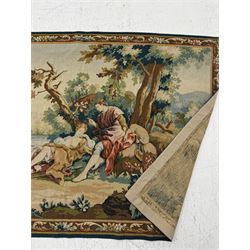 Large French machine woven tapestry, depicting figures in a landscape with a floral boarder 