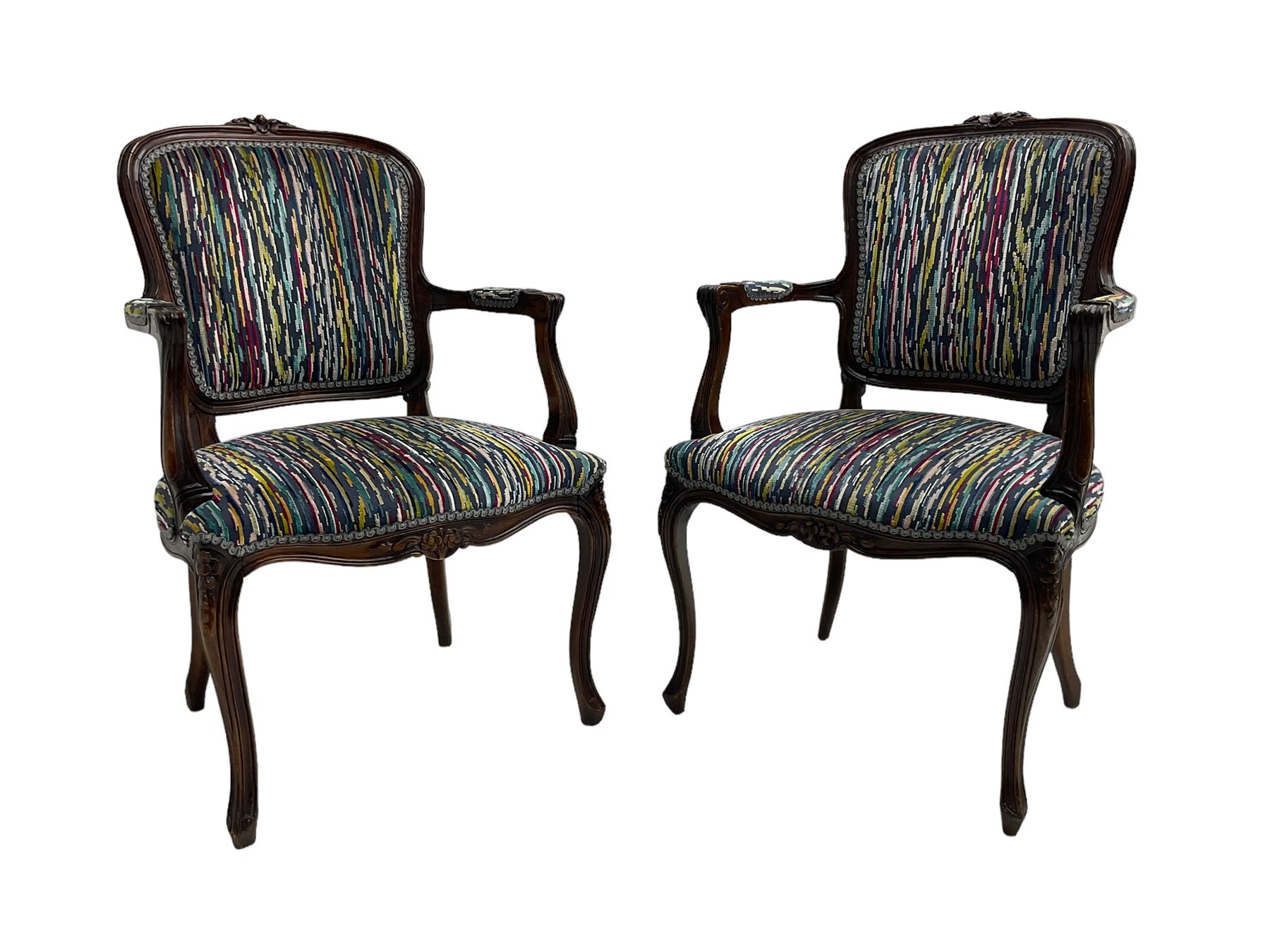 Pair of French design open armchairs, the moulded frame carved with flower heads, upholstered seat, back and arms, on cabriole supports