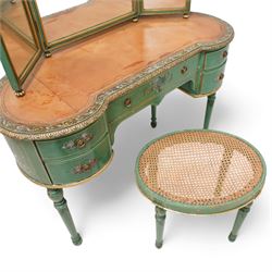 Edwardian Adam Revival green-painted and parcel gilt kidney-shaped dressing table, raised triple mirror back with shaped cresting, leather inset top within a trailing floral painted band and foliate carved edge, fitted with five drawers decorated with urn and floral bouquets, on turned supports painted with acanthus leaves and draped festoons; together with matching stool with cane seat 