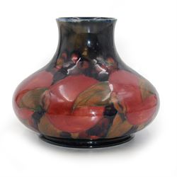 Moorcroft vase of squat form, decorated in Pomegranate pattern on a blue ground, with painted makers mark beath, H13cm 