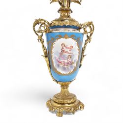 Pair of 19th century Sevres pattern porcelain and ormolu six light candelabra, each with branches cast as lilies, carnations etc, the two handled vase shaped base with oval panels painted with cherubs amongst flowers on a bleu de ciel surround and raised on an ormolu foliate stem and circular base with scrolling bracket feet H76cm (2)  