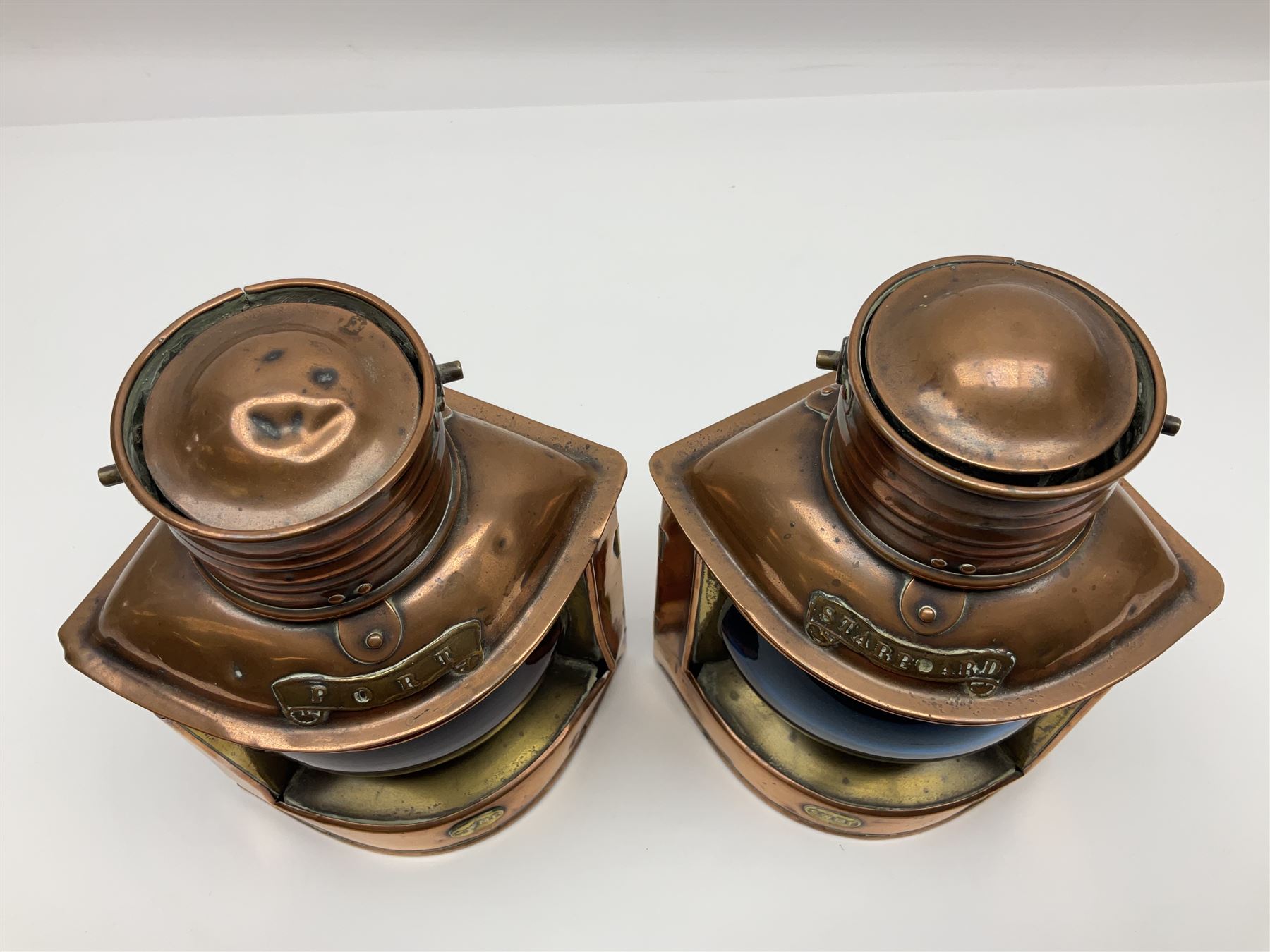 Pair of ‘Starboard’ and ‘Port’ copper ship lamps, of bow-fronted triangular form, H21cm